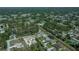 An aerial view showcasing the home's location surrounded by lush greenery in a residential area at 3284 Newmark St, North Port, FL 34291
