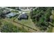 An aerial shot of a private home featuring a generously sized backyard lined with trees for privacy at 3284 Newmark St, North Port, FL 34291