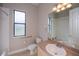 Neutral bathroom featuring a window with a bathtub shower combination at 3284 Newmark St, North Port, FL 34291