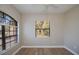 Comfortable bedroom with wood-look flooring and bright windows with nature views at 3284 Newmark St, North Port, FL 34291