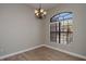 Cozy dining area with a chandelier and a large window for natural light at 3284 Newmark St, North Port, FL 34291