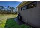 Exterior view of the home showcasing neutral tones and landscaped lawn at 3284 Newmark St, North Port, FL 34291