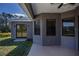 Exterior view of the home showcasing neutral tones and outdoor patio at 3284 Newmark St, North Port, FL 34291