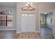 Bright foyer with tile accents, light walls, and wood-look flooring at 3284 Newmark St, North Port, FL 34291