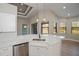 Kitchen featuring white cabinets, sleek countertops, stainless steel appliances and breakfast bar at 3284 Newmark St, North Port, FL 34291