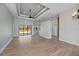 Spacious living room featuring modern flooring, tray ceilings, and ample natural light at 3284 Newmark St, North Port, FL 34291