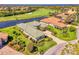 This lovely golf course property features lush landscaping and a long driveway leading up to the well maintained home at 3574 Pennyroyal Rd, Port Charlotte, FL 33953