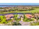A beautiful golf course property with mature landscaping and water views surrounds this pristine home in a quiet neighborhood at 3574 Pennyroyal Rd, Port Charlotte, FL 33953