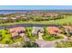 A beautiful golf course property with mature landscaping and water views surrounds this pristine home in a quiet neighborhood at 3574 Pennyroyal Rd, Port Charlotte, FL 33953