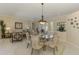Open dining area with an inviting view into the home's comfortable living room at 3574 Pennyroyal Rd, Port Charlotte, FL 33953