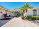 Inviting front entrance with paver walkway and lush landscaping at 3574 Pennyroyal Rd, Port Charlotte, FL 33953