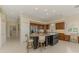 Gourmet kitchen featuring a center island with seating, stainless steel appliances, and ample cabinetry at 3574 Pennyroyal Rd, Port Charlotte, FL 33953