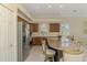 Kitchen with stainless steel appliances, granite countertop, and abundant cabinet space at 3574 Pennyroyal Rd, Port Charlotte, FL 33953
