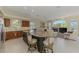 Gourmet kitchen with granite countertops, stainless steel appliances, and an island with bar seating at 3574 Pennyroyal Rd, Port Charlotte, FL 33953