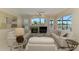 Bright and airy living room with view of pool and golf course at 3574 Pennyroyal Rd, Port Charlotte, FL 33953