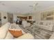 Spacious living room with comfortable seating, elegant decor, and seamless flow into other areas at 3574 Pennyroyal Rd, Port Charlotte, FL 33953