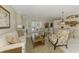 Open-concept living room features bright natural light and inviting seating arrangement at 3574 Pennyroyal Rd, Port Charlotte, FL 33953