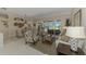 Living room featuring large sliding glass doors leading to the outdoor patio at 3574 Pennyroyal Rd, Port Charlotte, FL 33953