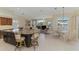 Spacious living area with island seating, fireplace, and breakfast nook at 3574 Pennyroyal Rd, Port Charlotte, FL 33953