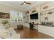 Office space features hardwood floors, white trim, and built-in shelving at 3574 Pennyroyal Rd, Port Charlotte, FL 33953