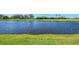 Picture of a tranquil pond with lush green grass in a lovely neighborhood at 3574 Pennyroyal Rd, Port Charlotte, FL 33953