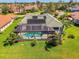 Beautiful screened pool in back yard and solar panels on roof of single Gathering home at 3574 Pennyroyal Rd, Port Charlotte, FL 33953