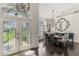 Foyer that opens up to a dining room with a view of the front entrance at 3615 Pennyroyal Rd, Port Charlotte, FL 33953