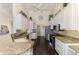 Well-lit kitchen with granite countertops, stainless steel appliances, and ample cabinet space at 3615 Pennyroyal Rd, Port Charlotte, FL 33953