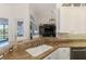 Kitchen featuring a granite counter with bar and stainless steel dishwasher, connecting to the living room at 3615 Pennyroyal Rd, Port Charlotte, FL 33953
