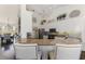 Kitchen featuring granite counters, stainless steel appliances, and a breakfast bar at 3615 Pennyroyal Rd, Port Charlotte, FL 33953