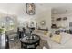 Bright living room with modern decor including a decorative mirror, stylish furniture, and bar top access at 3615 Pennyroyal Rd, Port Charlotte, FL 33953