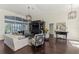 A living room that features dark hardwood floors and seating for all at 3615 Pennyroyal Rd, Port Charlotte, FL 33953