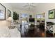 Bright living room with views of lanai, lake, and access to screened-in patio at 3615 Pennyroyal Rd, Port Charlotte, FL 33953