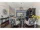 Bright living room with comfortable seating and an entertainment center at 3615 Pennyroyal Rd, Port Charlotte, FL 33953