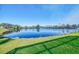 Picturesque waterfront property with a stunning lake view from the green lawn at 3615 Pennyroyal Rd, Port Charlotte, FL 33953