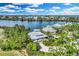 Stunning aerial view of waterfront homes with lush landscaping and beautiful waterfront access at 38 Seawatch Lake Dr, Boca Grande, FL 33921