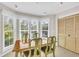Cozy breakfast nook filled with natural light from the bay window, perfect for casual dining at 38 Seawatch Lake Dr, Boca Grande, FL 33921