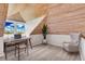 Office with vaulted wooden plank ceiling and view of the water through the window at 38 Seawatch Lake Dr, Boca Grande, FL 33921