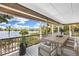 Inviting outdoor patio is ideal for dining and entertaining while enjoying water views at 38 Seawatch Lake Dr, Boca Grande, FL 33921