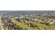 Aerial view showcasing a community with residential homes and waterways at 4 Sportsman Ln, Rotonda West, FL 33947