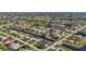 High aerial shot showcasing residential homes and lush green spaces at 4 Sportsman Ln, Rotonda West, FL 33947