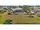 Birds eye view of a home showcasing the backyard with pool and mature landscaping at 4 Sportsman Ln, Rotonda West, FL 33947