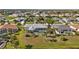 Aerial view of a residential community with well-maintained lawns and screened-in pools at 4 Sportsman Ln, Rotonda West, FL 33947