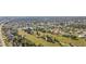Scenic aerial view of community with homes, waterways and golf course at 4 Sportsman Ln, Rotonda West, FL 33947