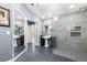 This large bathroom features dual vanities, a step-in shower, and a large mirror at 4 Sportsman Ln, Rotonda West, FL 33947