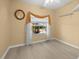Bedroom includes a cream-colored wall, hardwood floors, and a double-hung window at 4 Sportsman Ln, Rotonda West, FL 33947