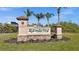 A community welcome sign with lush landscaping at 4 Sportsman Ln, Rotonda West, FL 33947