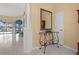 Open foyer featuring marble floors, a decorative table, and clear views of the swimming pool in the back at 4 Sportsman Ln, Rotonda West, FL 33947
