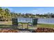 Enjoy the peaceful lake view from the backyard with seating at 4 Sportsman Ln, Rotonda West, FL 33947
