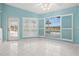 Bright living area with white tile flooring, pool views, and shuttered windows at 4 Sportsman Ln, Rotonda West, FL 33947